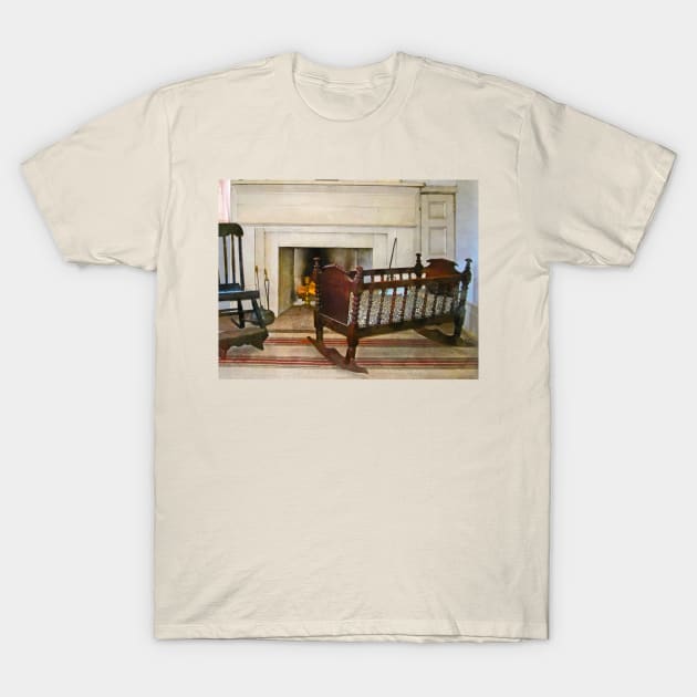 Interiors - Cradle Near Fireplace T-Shirt by SusanSavad